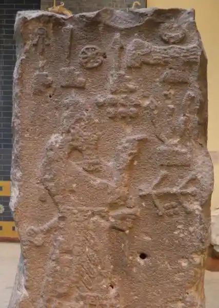 Solar disc and winged disc on a stele of king Adad Nirari III